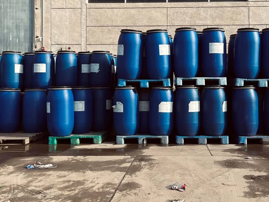 Blue solvent drums on pallets